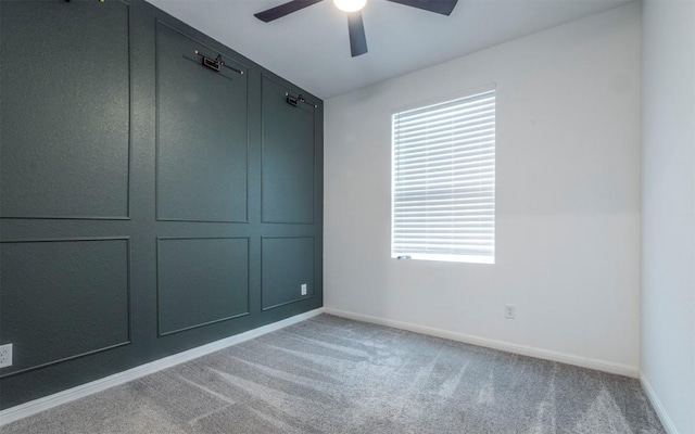 unfurnished room with ceiling fan, carpet flooring, and baseboards