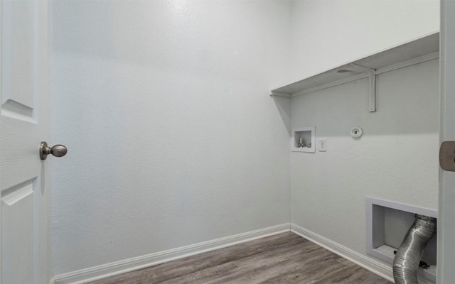 clothes washing area with gas dryer hookup, laundry area, washer hookup, baseboards, and dark wood-style floors