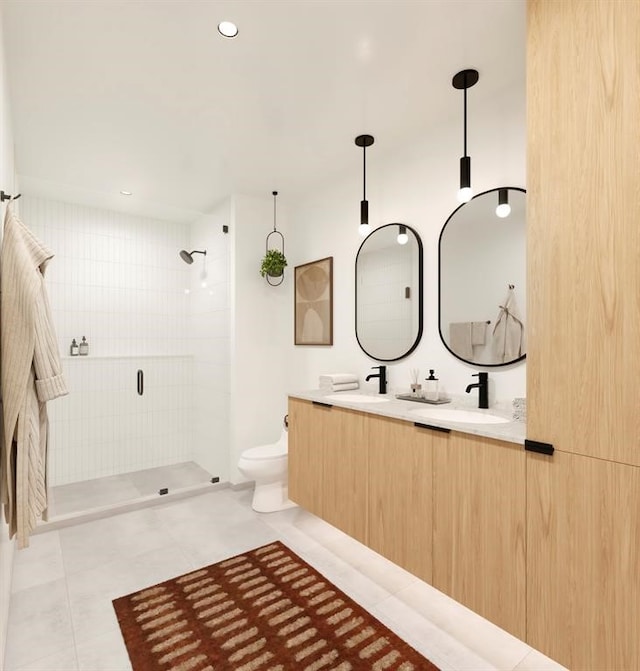 bathroom featuring tile patterned floors, a tile shower, vanity, and toilet