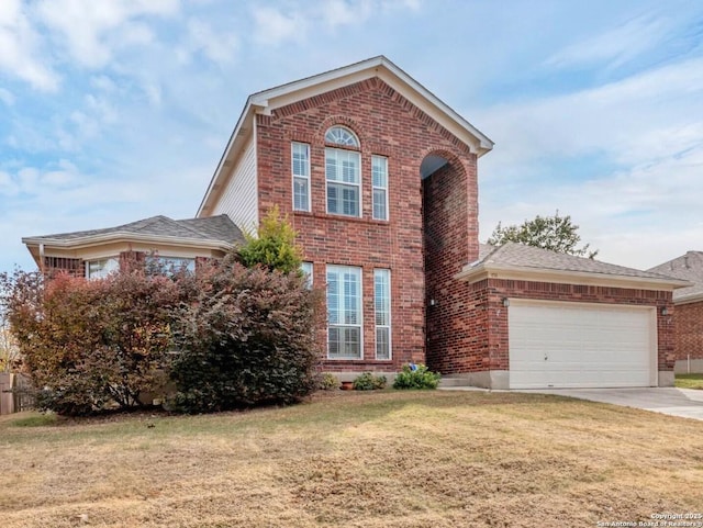 view of front of property with a garage and a front lawn