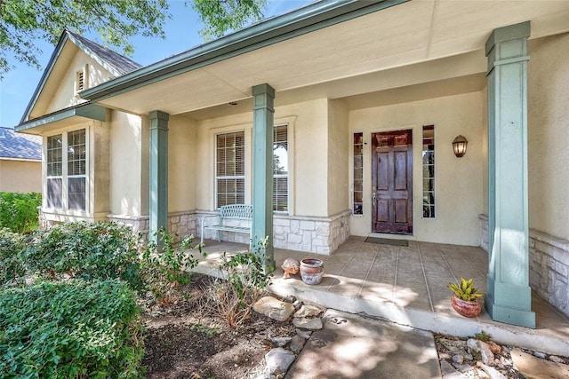 doorway to property featuring a porch