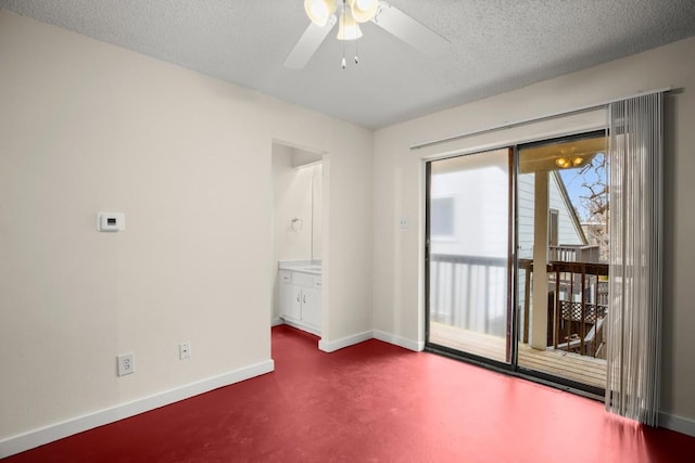 spare room featuring ceiling fan and a textured ceiling