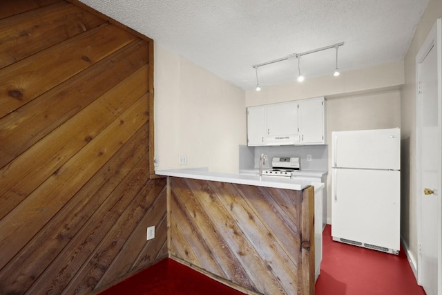 4205 Speedway Ave Unit 204, Austin, TX 78751 - kitchen with freestanding refrigerator, range with electric stovetop, white cabinetry, a peninsula, and light countertops