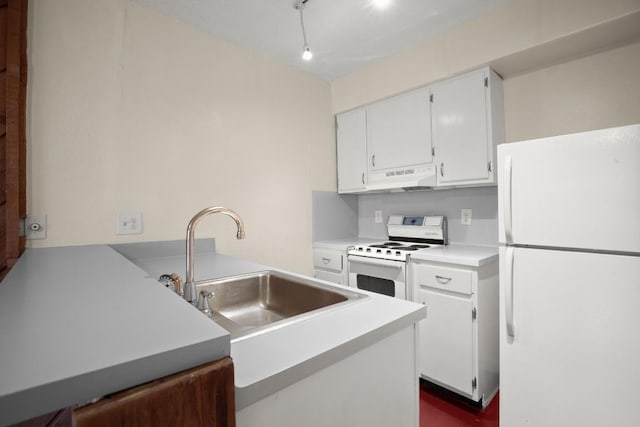 kitchen with white cabinetry, sink, white appliances, and kitchen peninsula