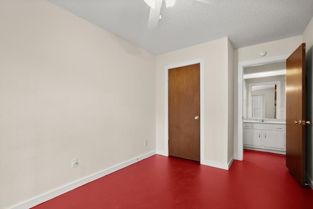 4205 Speedway Ave Unit 204, Austin, TX 78751 - unfurnished bedroom featuring baseboards, a textured ceiling, ceiling fan, and concrete flooring