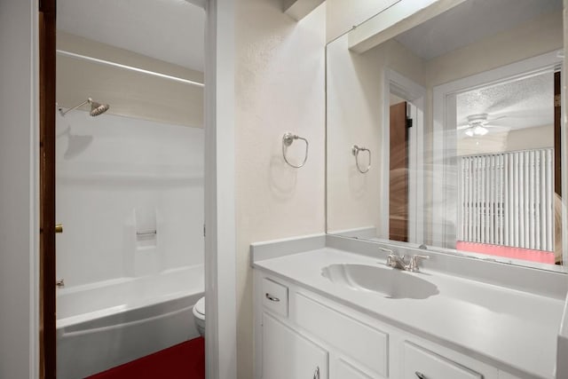 4205 Speedway Ave Unit 204, Austin, TX 78751 - bathroom featuring toilet, vanity, shower / washtub combination, a ceiling fan, and a textured ceiling