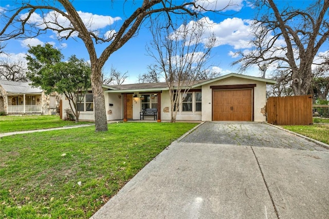 ranch-style home with a garage and a front lawn