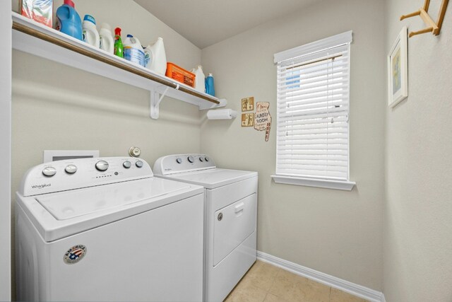 1017 Matheson Dr, Leander, TX 78641 - laundry area with washing machine and dryer, baseboards, and light tile patterned flooring