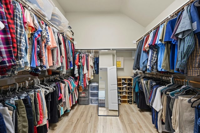 1017 Matheson Dr, Leander, TX 78641 - walk in closet featuring wood finished floors and lofted ceiling