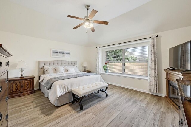 1017 Matheson Dr, Leander, TX 78641 - bedroom with light wood-style flooring, baseboards, lofted ceiling, and a ceiling fan