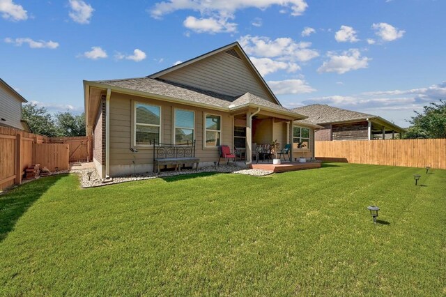 1017 Matheson Dr, Leander, TX 78641 - rear view of house with a patio area and roof with shingles