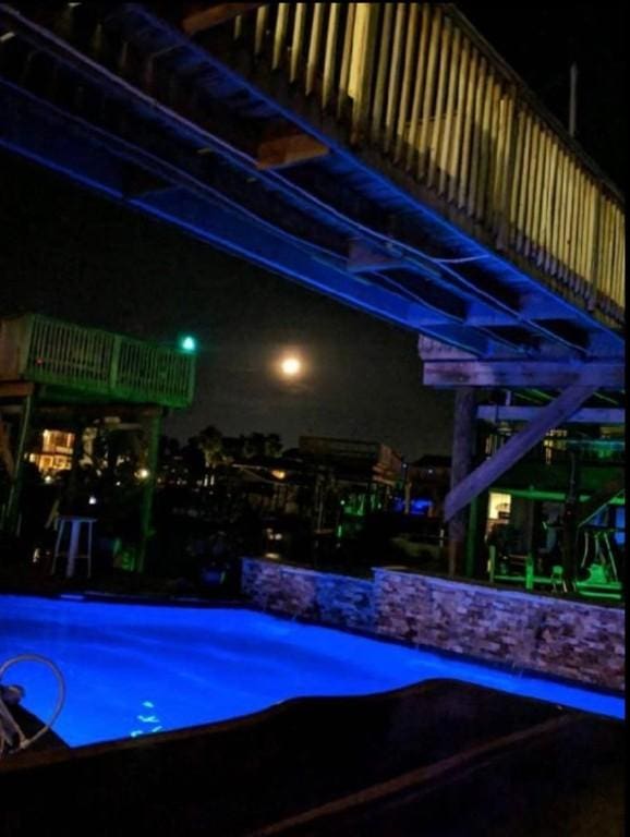 view of pool at night