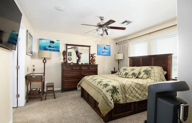 bedroom featuring light colored carpet and ceiling fan