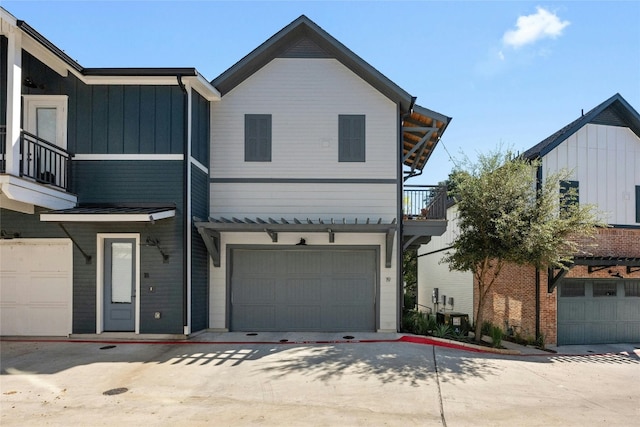 view of front of home featuring a garage and a balcony