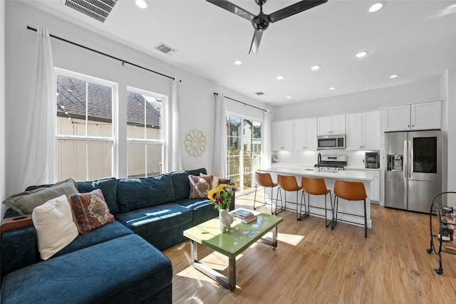 3809 Valley View Rd Unit 19, Austin, TX 78704 - living area featuring light wood-style floors, recessed lighting, and a ceiling fan