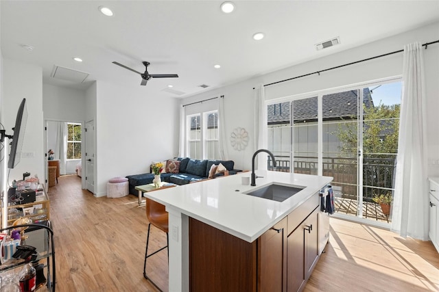 3809 Valley View Rd Unit 19, Austin, TX 78704 - kitchen with a sink, light wood-style floors, a ceiling fan, recessed lighting, and open floor plan