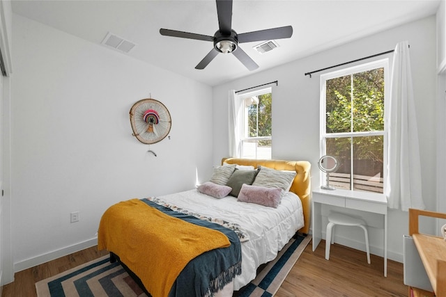 3809 Valley View Rd Unit 19, Austin, TX 78704 - bedroom featuring baseboards, wood finished floors, and a ceiling fan