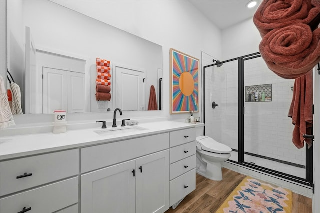 3809 Valley View Rd Unit 19, Austin, TX 78704 - full bath featuring vanity, a stall shower, toilet, wood finished floors, and recessed lighting