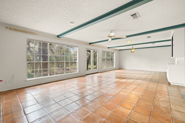 interior space with light tile patterned flooring, ceiling fan, a textured ceiling, and beamed ceiling