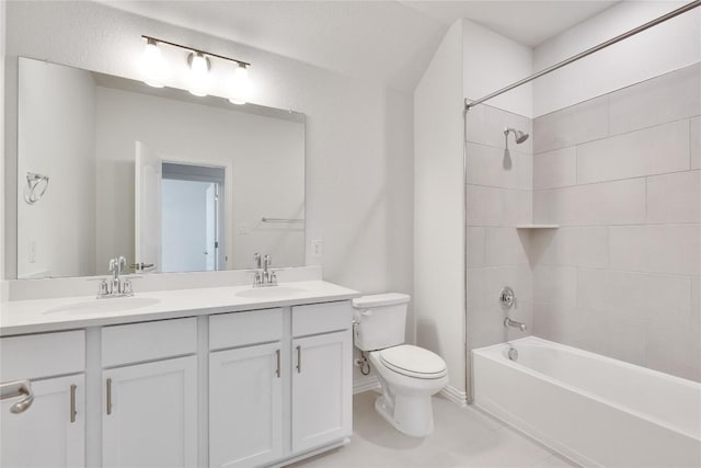 full bath with shower / bath combination, a sink, double vanity, and toilet