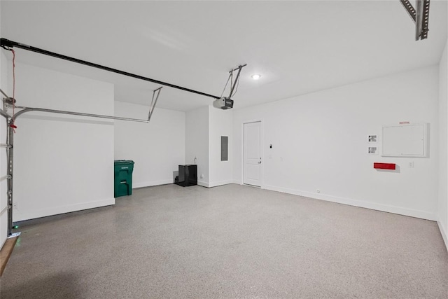2707 Dulce Ln Unit 7, Austin, TX 78704 - garage featuring a garage door opener and electric panel