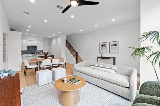 2707 Dulce Ln Unit 7, Austin, TX 78704 - living room featuring light wood-type flooring, recessed lighting, stairway, and a ceiling fan