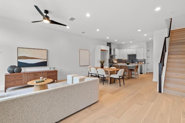 2707 Dulce Ln Unit 7, Austin, TX 78704 - living area with light wood-type flooring, stairs, recessed lighting, and ceiling fan