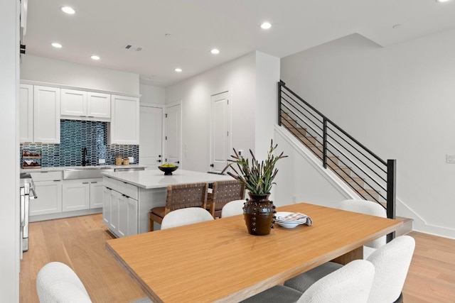 2707 Dulce Ln Unit 7, Austin, TX 78704 - dining space with light wood-type flooring, stairway, and recessed lighting