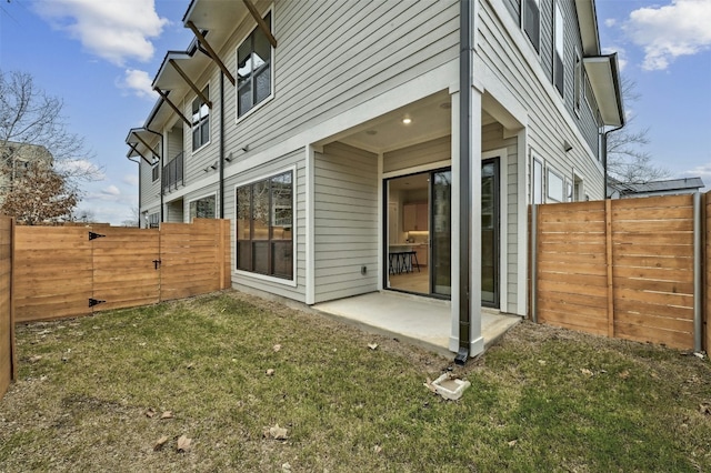 2707 Dulce Ln Unit 12, Austin, TX 78704 - rear view of property with a patio and a gate