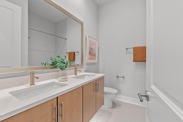 2707 Dulce Ln Unit 12, Austin, TX 78704 - full bath featuring double vanity, toilet, tile patterned floors, a shower, and baseboards