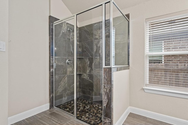 bathroom with a shower with shower door