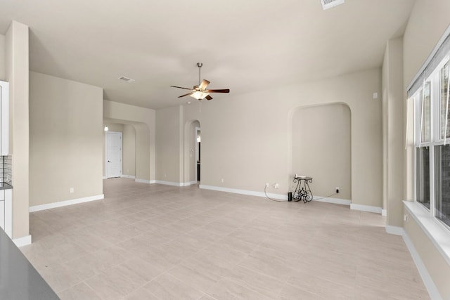 unfurnished living room with ceiling fan