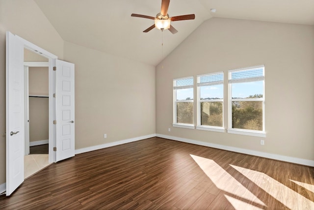 unfurnished bedroom with hardwood / wood-style floors, high vaulted ceiling, and ceiling fan