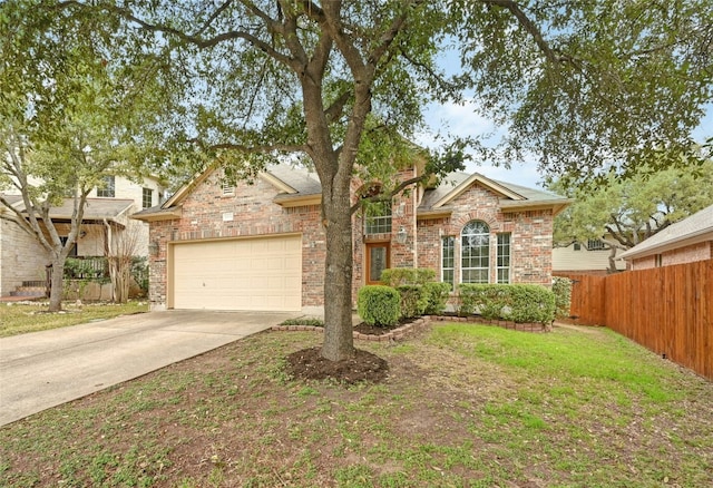 view of front facade with a garage and a front lawn