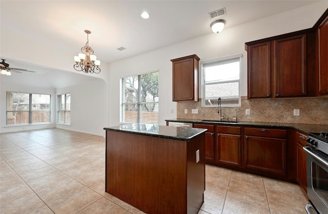 10104 Hibiscus Cv, Austin, TX 78739 - kitchen with a sink, a center island, light tile patterned floors, decorative backsplash, and recessed lighting