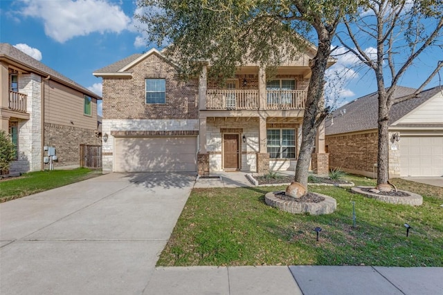 view of front of house featuring a garage, a balcony, and a front lawn