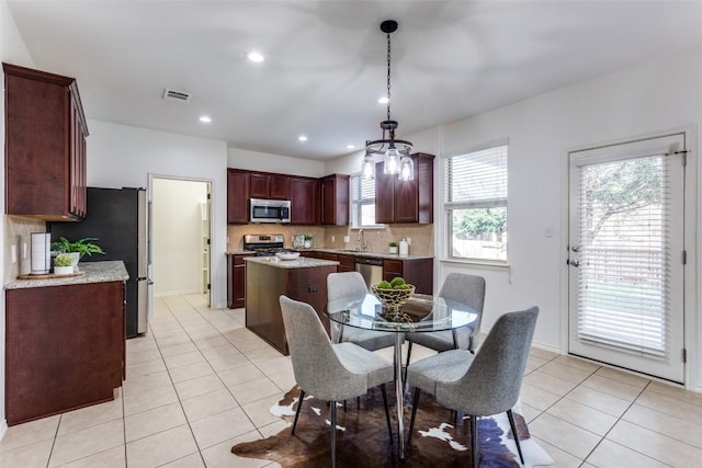 dining area featuring recessed lighting, light tile patterned floors, visible vents, and baseboards