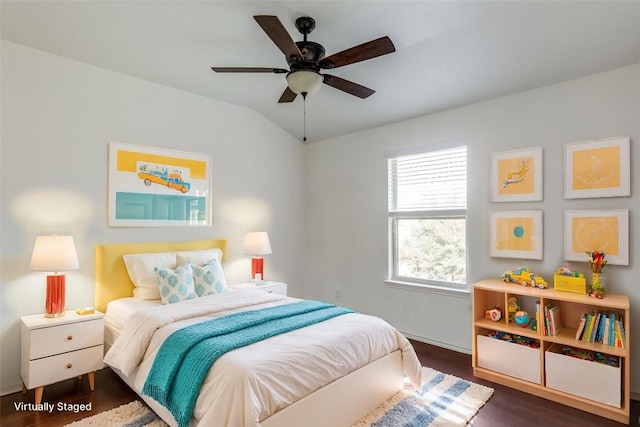 bedroom with a ceiling fan, baseboards, dark wood-style floors, and vaulted ceiling