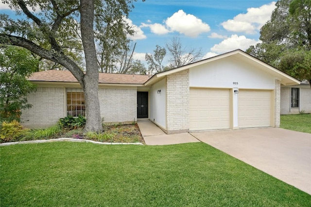 ranch-style house with a garage and a front yard