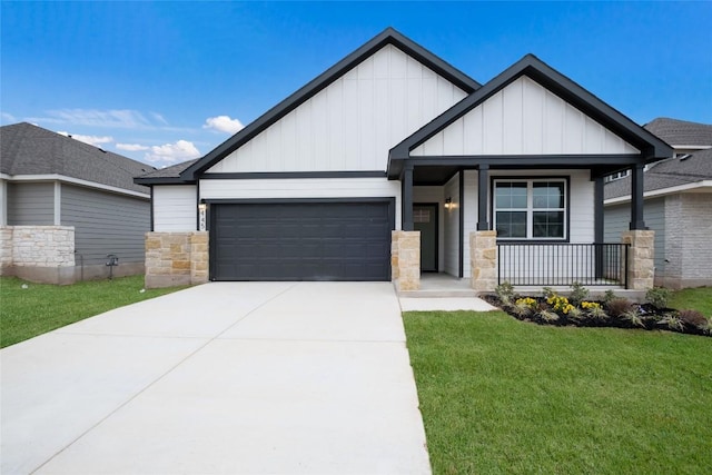 craftsman inspired home featuring a garage, a front yard, and covered porch