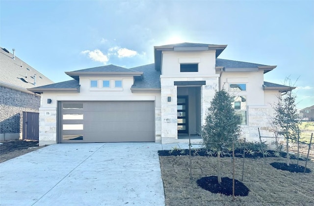 prairie-style house featuring a garage