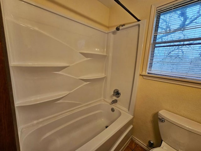 bathroom with shower / tub combination and toilet