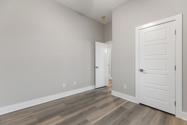 unfurnished bedroom featuring hardwood / wood-style floors