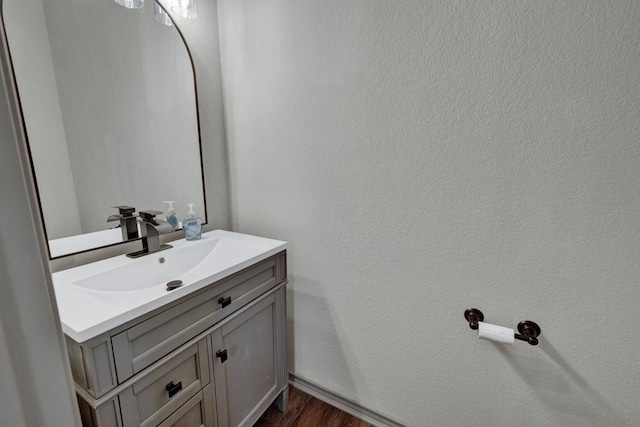 bathroom featuring vanity and hardwood / wood-style floors