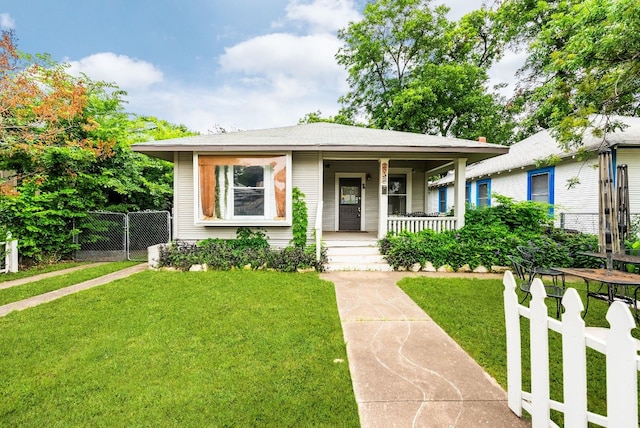 bungalow-style home with a porch and a front lawn