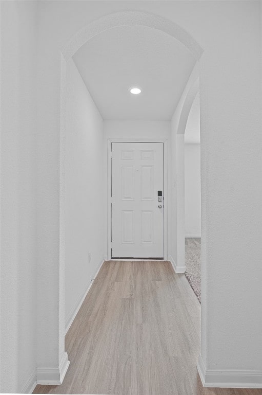 corridor with light wood-type flooring