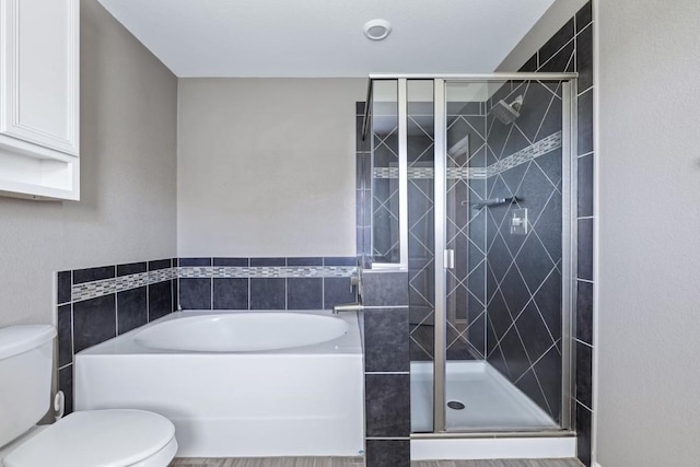 bathroom with shower with separate bathtub and toilet