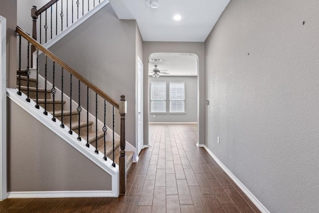 foyer featuring wood-type flooring and ceiling fan