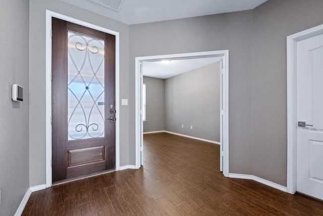 foyer with dark hardwood / wood-style flooring