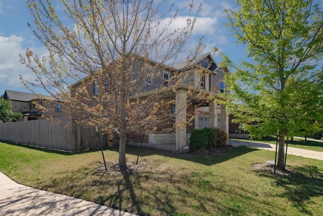 view of side of home featuring a lawn